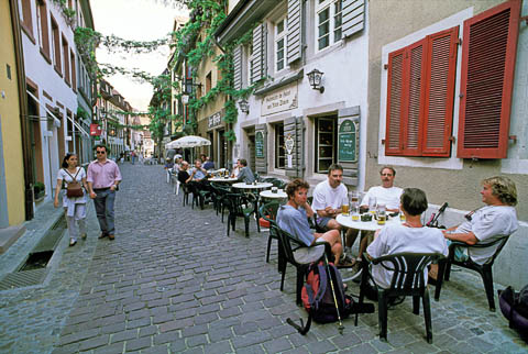 A small outdoor café that fits in a narrow street, Freiburg, Germany